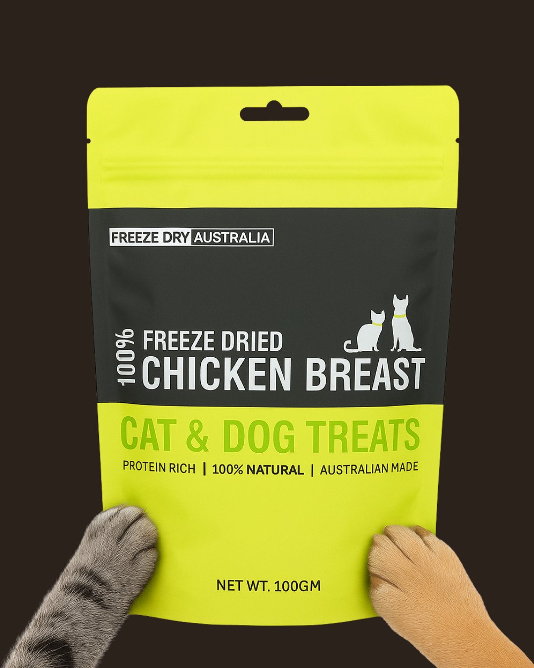 A cat paw and a dog paw holding a bag of Freeze Dry Australia Chicken Breast
