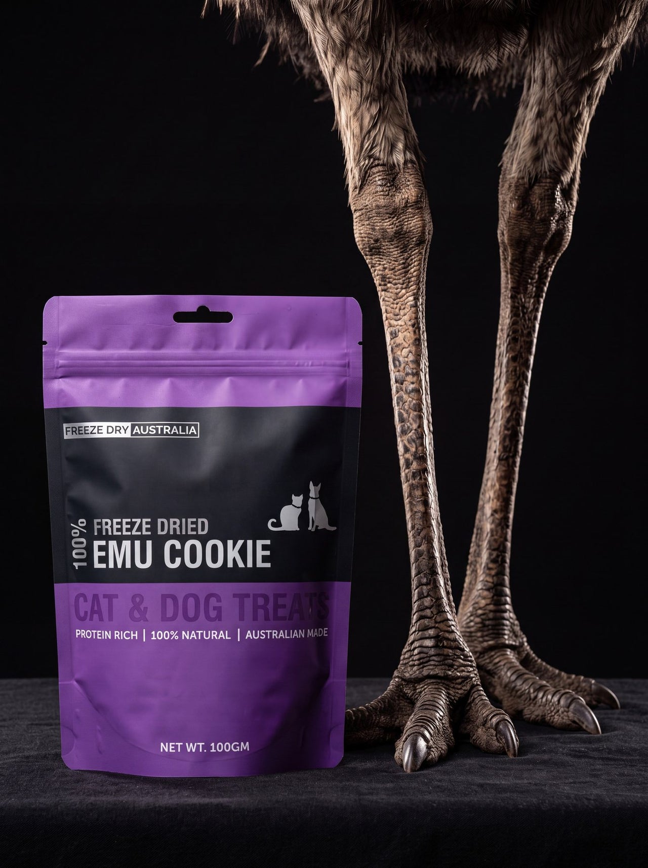 A bag of Emu Cookie beside the legs of an emu